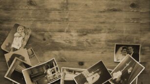 old family pictures on a wooden table