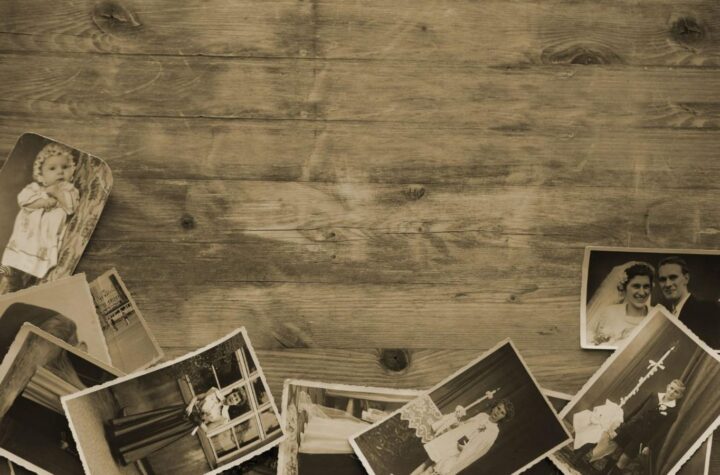 old family pictures on a wooden table